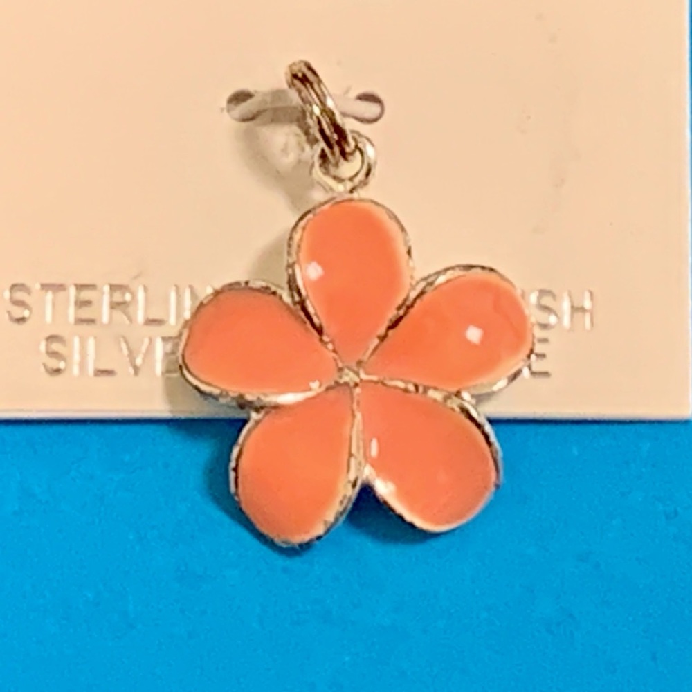 Sterling silver and pink enamel flower pendant.